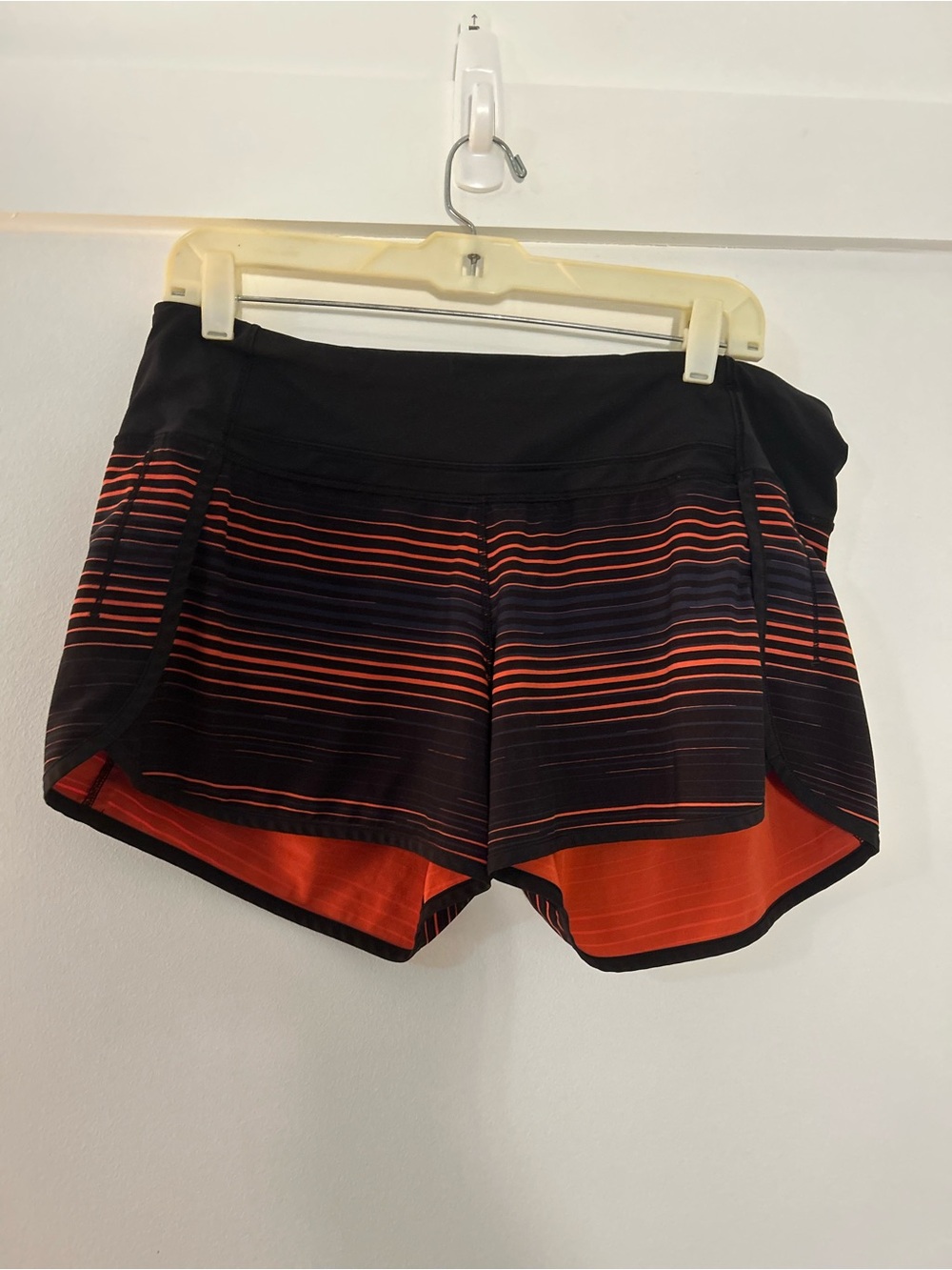 lululemon athletica Speed Up Short Size 10 Blk, Orange and Navy Stripes.